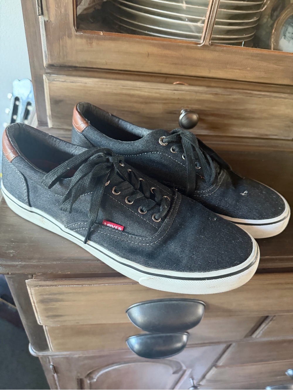 Levi's Black Canvas Low-Top Sneakers with Brown Heel Accent and White Sole